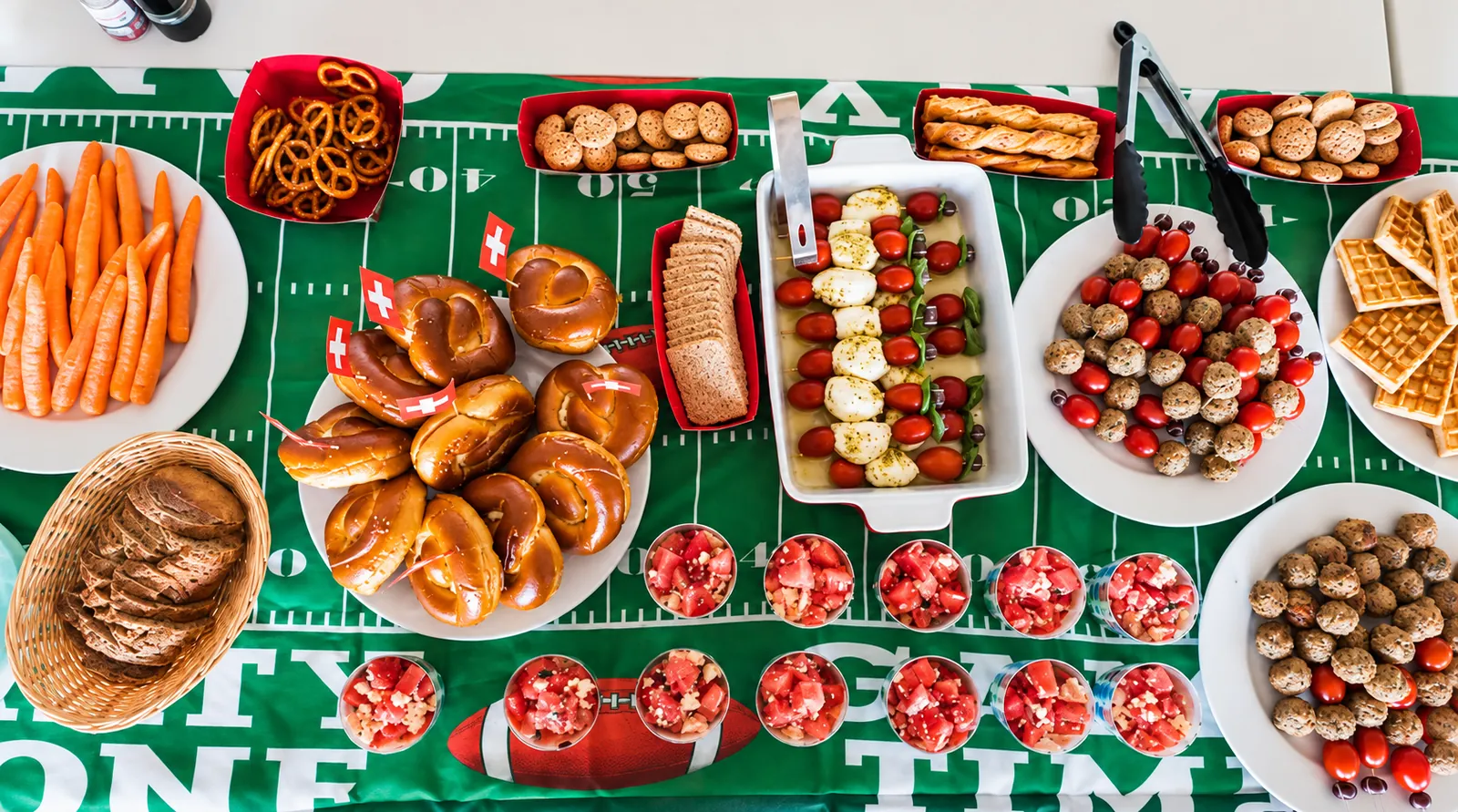 Game day buffet on a football themed table