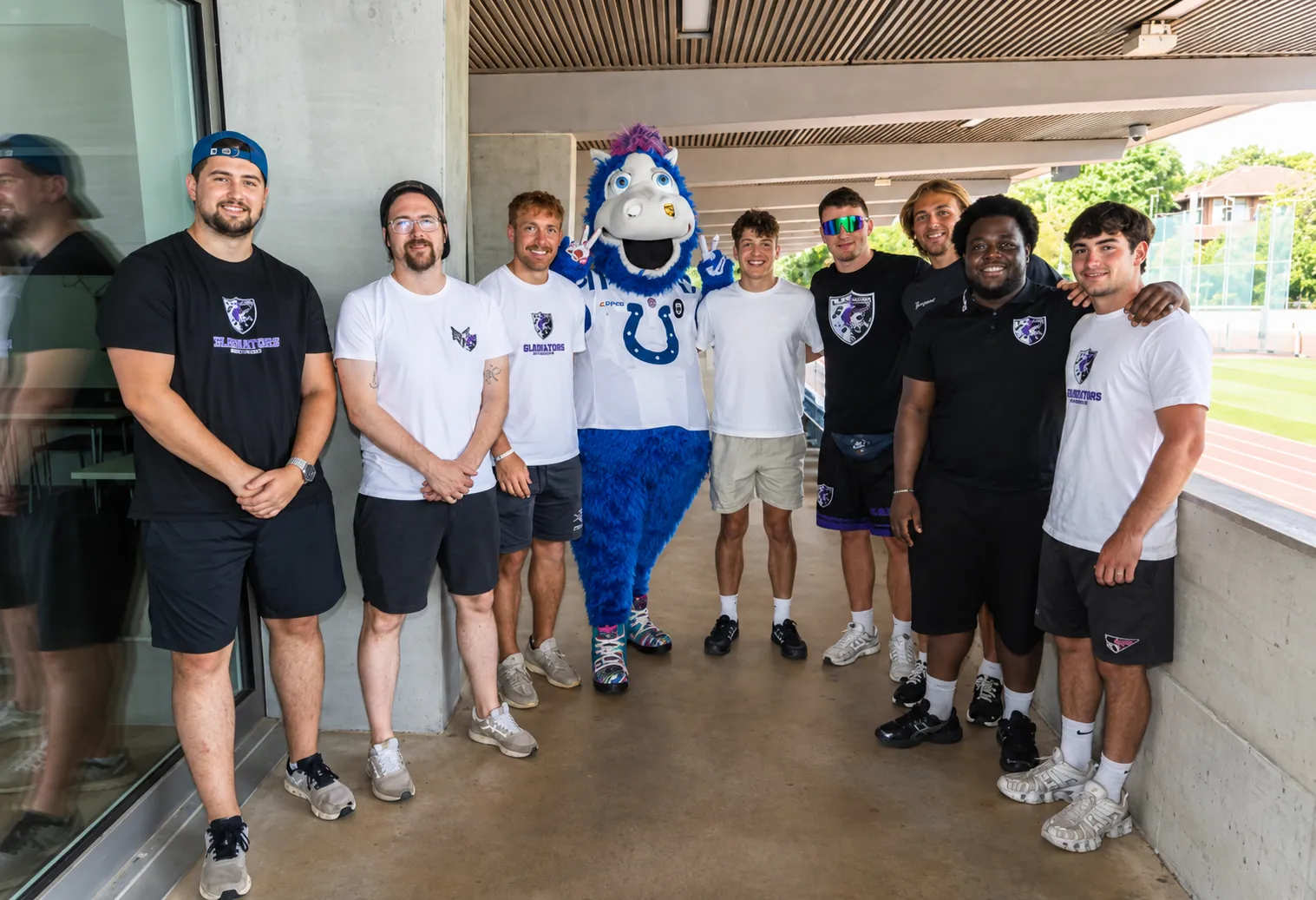 Gladiators Basel players with the Colts mascot at Rankhof